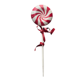  A large, round, red and white striped lollipop-shaped ornament with a ribbon bow attached, hanging on a wall with Christmas decorations.