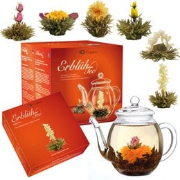 Blooming tea set with glass teapot, white tea leaves, and colorful flower buds. Includes a gift box.