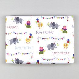 Wrapping paper with colorful elephants, presents, and "Happy Birthday" text. The wrapping paper features a repeating pattern of gray elephants, birthday cakes, balloons, and party decorations.