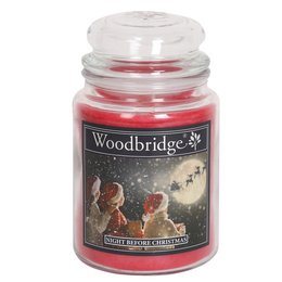 Large, round, red scented candle in a glass jar with a Christmas-themed label depicting Santa Claus and reindeer.