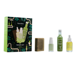 A gift set containing a mojito-themed beauty products, including a hand cream, soap, and two serums in green and white packaging.