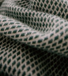  Large, cozy forest-green wool blanket with a textured diamond pattern.