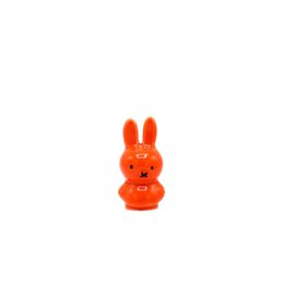  Bright orange rabbit figurine with distinctive long ears and a simple, stylized design.