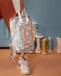 A gray backpack with a hedgehog print, suitable for kids. The backpack has a rectangular shape, adjustable straps, and a zipper closure.