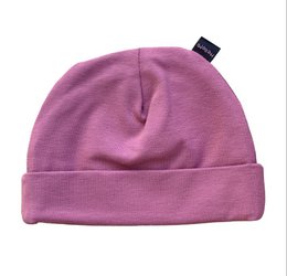 Soft, cozy pink baby hat with a simple, minimalist design. Made of high-quality, breathable material for comfort and warmth.