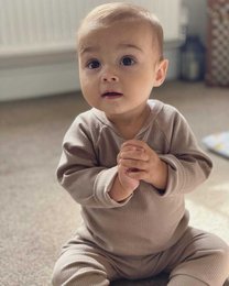 Taupe loungewear for kids, available in sizes 6-9, 9-12, 2-3 years, 3-4 years, and 4-5 years. Made of soft, comfortable material in a neutral taupe color.