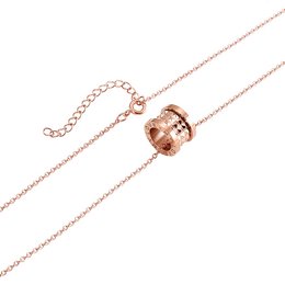 Rose gold-tone pendant necklace with a circular charm featuring a cutout design.