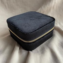  Black square jewelry box with mirror. Made of durable material. Ideal for storing and organizing jewelry. Compact and portable design.