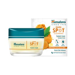  Turmeric dark spot clearing cream, yellow orange turmeric ingredient, teal green packaging, face treatment skincare product.