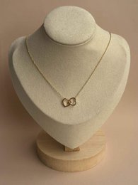  Gold-toned interlocking circles pendant chain necklace, delicate minimalist jewelry design.