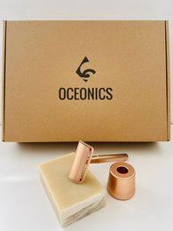 Rosé-colored round safety razor in gift box from Ocenonics brand for hair removal.