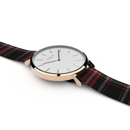 Rose gold and silver watch with a classic round face and a plaid strap.