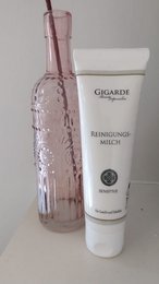 Cleansing milk in a 100 ml bottle, a gentle facial cleanser for sensitive skin.