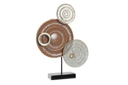 Decorative metal sculpture with circular terracotta elements, featuring a mix of textures and neutral tones.