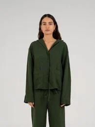 Green linen shirt with long sleeves and a V-neck collar. Suitable for casual or formal wear.