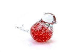 Decorative red glass bird figurine with bubbles, suitable for display or as a collectible item.