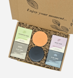  Pampering gift set containing a variety of beauty products including a compact mirror, soap, and bath salts.