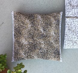 Decorative cushion with a textured, patterned design in beige, white, and navy blue colors. The cushion has a square shape and is suitable for use in various home decor settings.