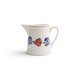  White ceramic milk jug with blue floral and red berry design, small pouring pitcher, farmhouse style tableware.