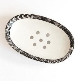 Small oval soapstone soap dish with intricate black and white patterned border.