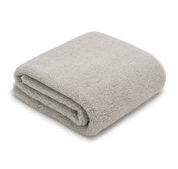 A cozy, soft merino wool blanket in a neutral gray color. The blanket is available in three sizes: 140x200 cm, and comes in light gray, dark gray, and beige color variants.