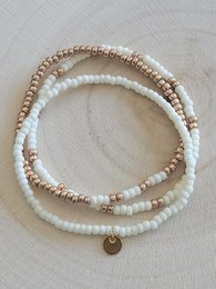  Cream beaded bracelets set, small round beads, delicate stacked design with charm pendant.