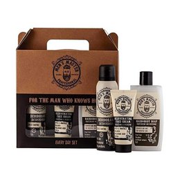 A gift set containing a variety of men's skincare products, including a 485ml bottle. The set features a brown cardboard box with the brand's logo and text "For the man who knows how..."