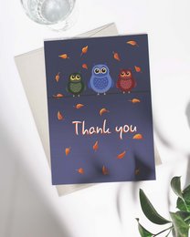 Autumn-themed thank you card featuring colorful owls and leaves on a navy blue background.