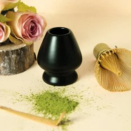 Black matcha whisk holder, bamboo whisk and spatula, green matcha powder, Japanese tea ceremony set