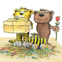 A colorful pop-up birthday card featuring a yellow bear and a brown bear standing together on a grassy field, with a red tulip in the foreground.