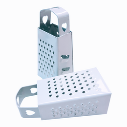 White mini grater with heart-shaped perforations, 7.5cm size, suitable for grating amber cubes.