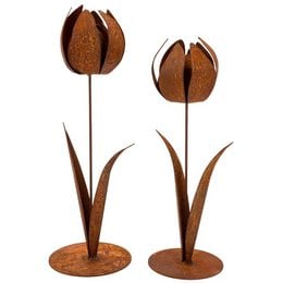 Rust-colored metal tulip sculptures, featuring two tulip-shaped flowers on long stems. The sculptures have a rustic, natural appearance and are suitable for use as table decorations or garden accents in the spring season.