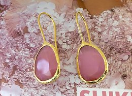 Pink stone cat-eye drop earrings with gold-tone metal frame.