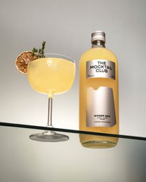  Mocktail Ginger Gem 99cl, a non-alcoholic ginger-flavored beverage with a vibrant yellow color and a garnish of lemon slice and rosemary sprig.