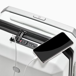 A large, white cabin luggage with a sleek, modern design. The luggage has a telescopic handle and wheels for easy mobility. It appears to be made of a durable, lightweight material.