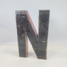 Recycled oil barrel letter 'N' magnets available in various sizes (22cm or 50cm) and colors (black, blue, brown, green, orange, pink, red, red-orange, turquoise, white, yellow, bicolor).