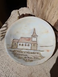 Decorative plate with hand-painted landscape motif featuring a church building. Suitable for home decor or as a unique gift item.