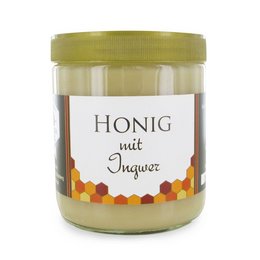 Ginger-infused honey in a glass jar with a green lid. The label on the jar reads "Honig mit Ingwer" which means "Honey with Ginger" in German.