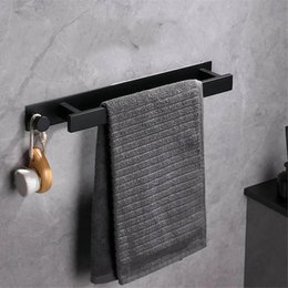 Minimalist black metal towel rack with a simple, clean design. Suitable for hanging and storing towels in a bathroom or kitchen.