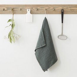 Forest green linen kitchen towel with a simple, minimalist design. Absorbent and durable for everyday kitchen use.