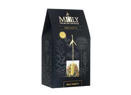 Organic herbal tea in a black and gold package with a decorative design. The tea is presented in a box with a transparent window, showcasing the tea bags inside.