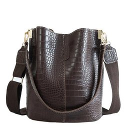 A large, brown shoulder bag with a textured crocodile-like pattern. The bag has a rectangular shape and a detachable shoulder strap, making it suitable for everyday use.