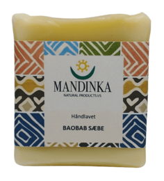 This 100-gram soap bar features a natural, handcrafted design with vibrant geometric patterns in earthy tones. The soap is made with baobab oil, providing a moisturizing and nourishing cleansing experience.