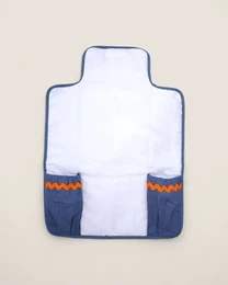 White changing mat with marine blue borders, orange and navy wave pattern details, padded design for babies.