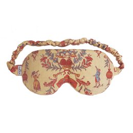  Floral patterned sleep mask with soft, comfortable fabric. Features a relaxing, whimsical design in shades of pink, purple, and beige.