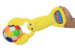 Sand Snapper, recogedor de arena amarillo con diseño de cangrejo