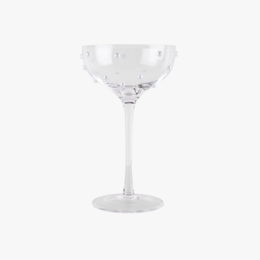 Clear glass champagne coupe with a tall, slender stem.
