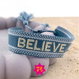  Blue woven bracelet with "BELIEVE" text in gold. Suitable for casual wear or as a fashion accessory.