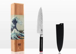 A 200 mm chef's knife with a hammered stainless steel blade, a bamboo saya (sheath), and a bamboo box. The knife features a traditional Japanese gyuto style design.