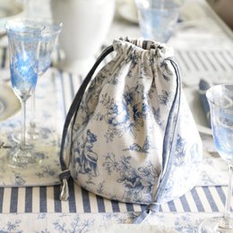 Blue and white toile de Jouy pattern bread box, French-style striped design, drawstring closure, rectangular shape.
